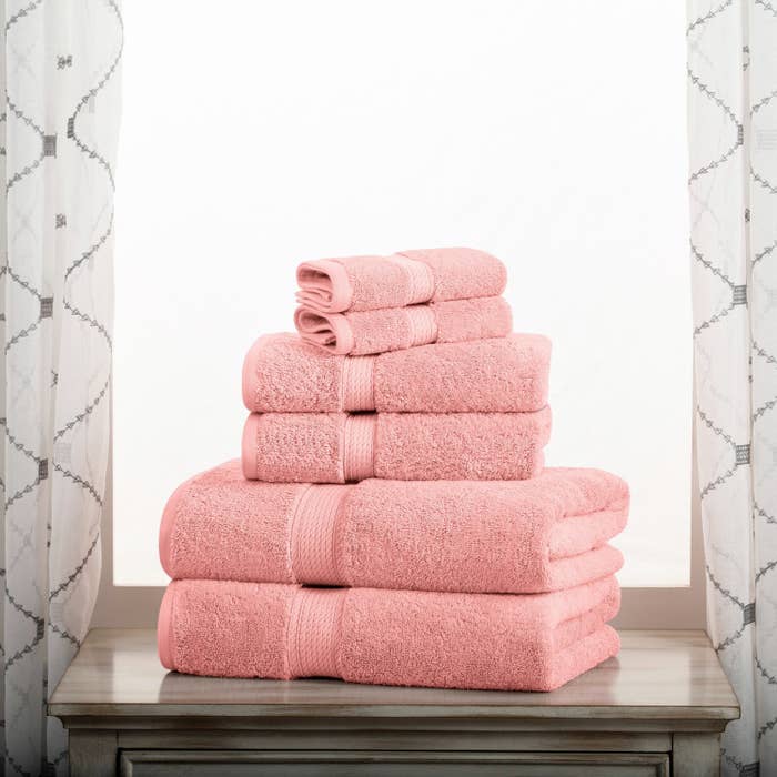 a stack of the folded pink towels