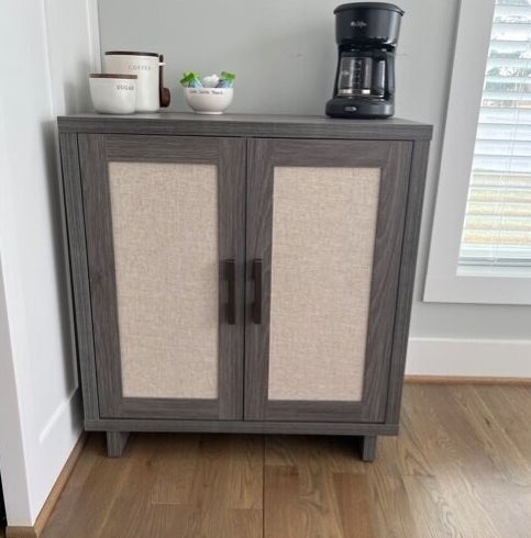 The gray cabinet with two doors