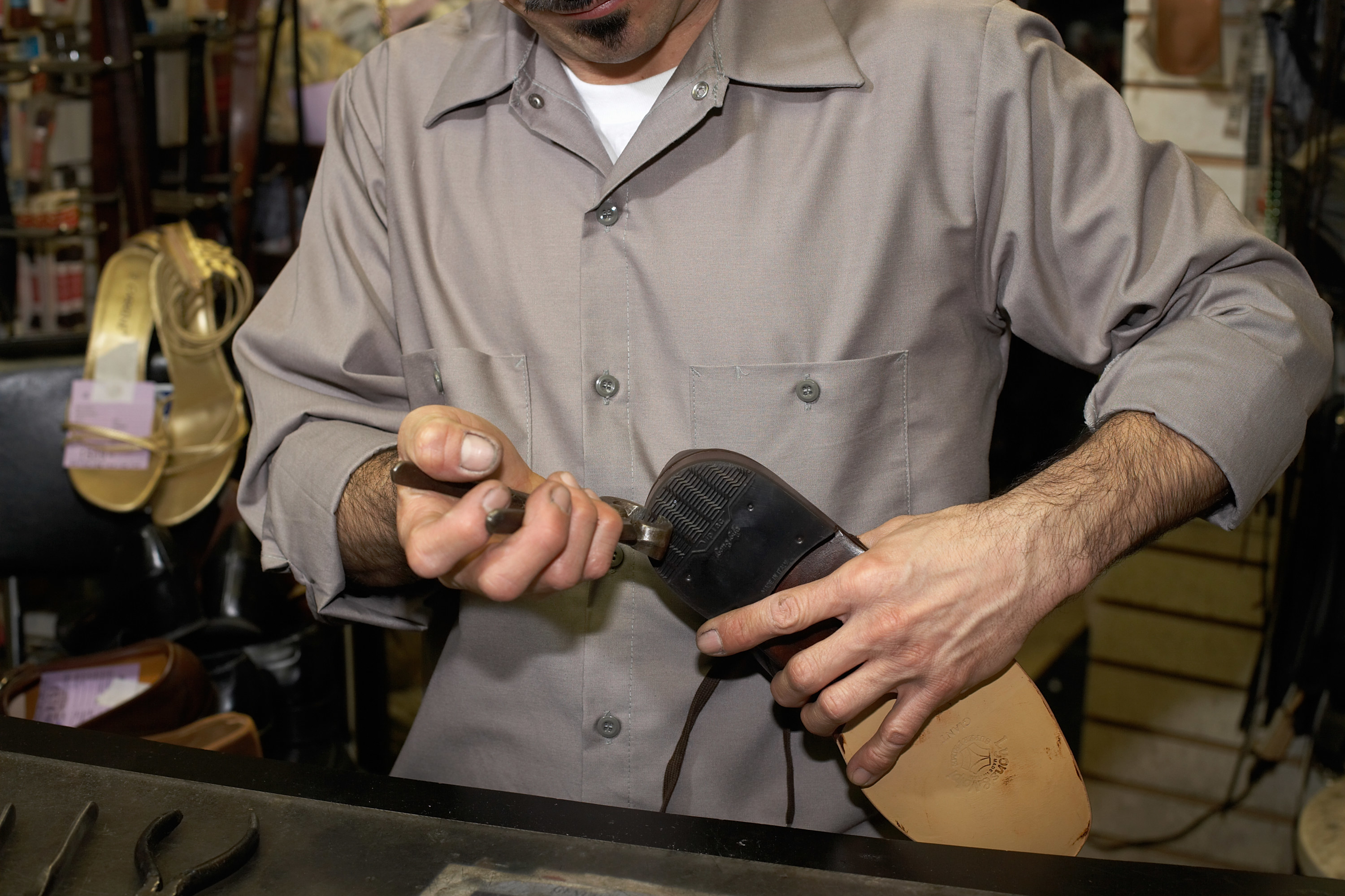 shoemaker working on a shoe