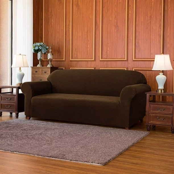 a coffee-colored couch cover on a couch in a living room