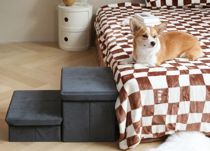 the gray steps next to a bed