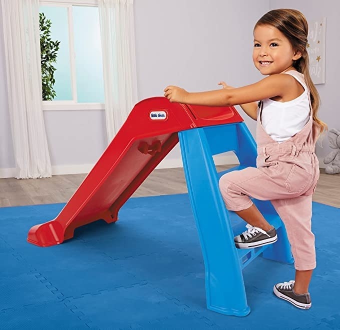 Child climbs a slide