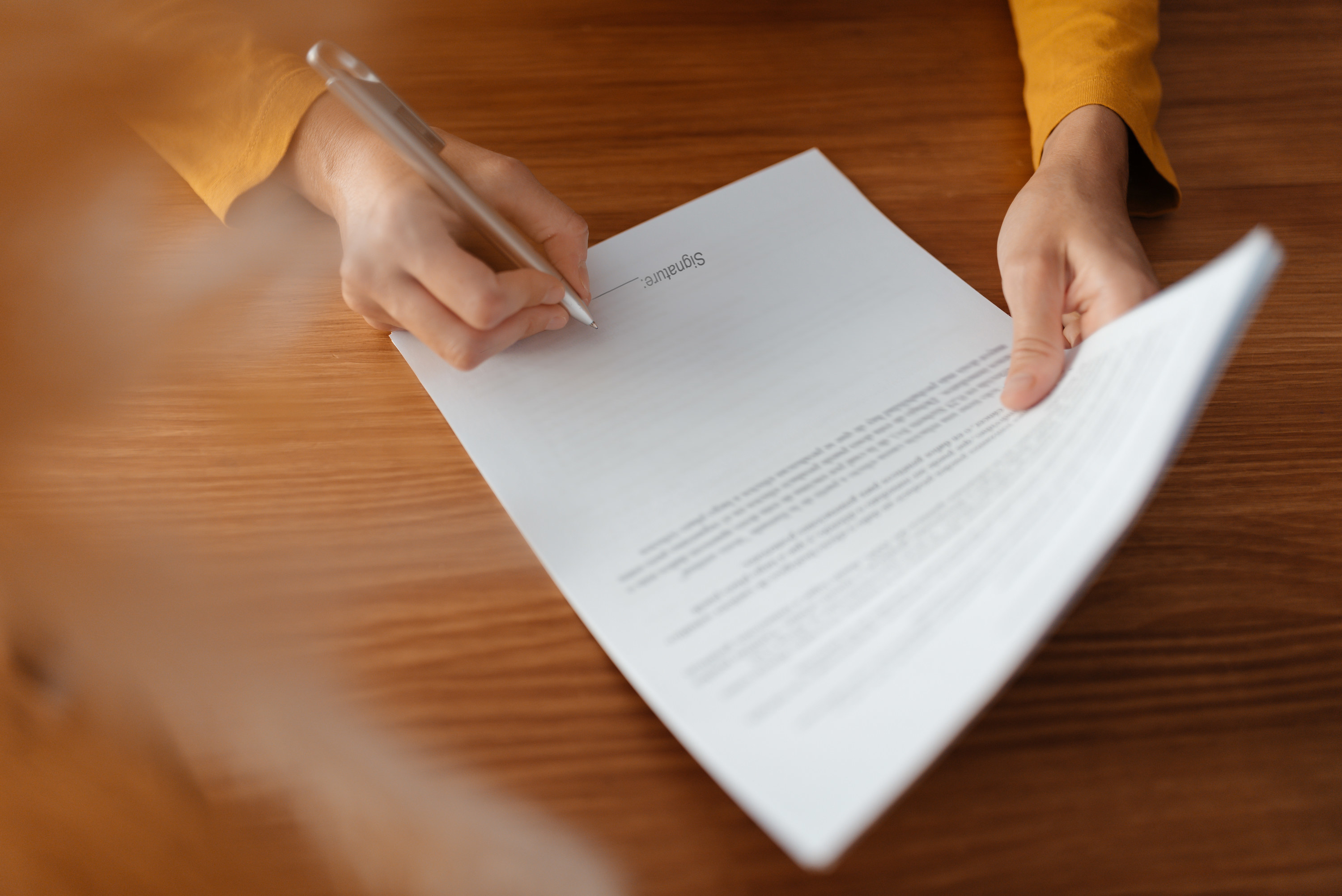A person signing a contract