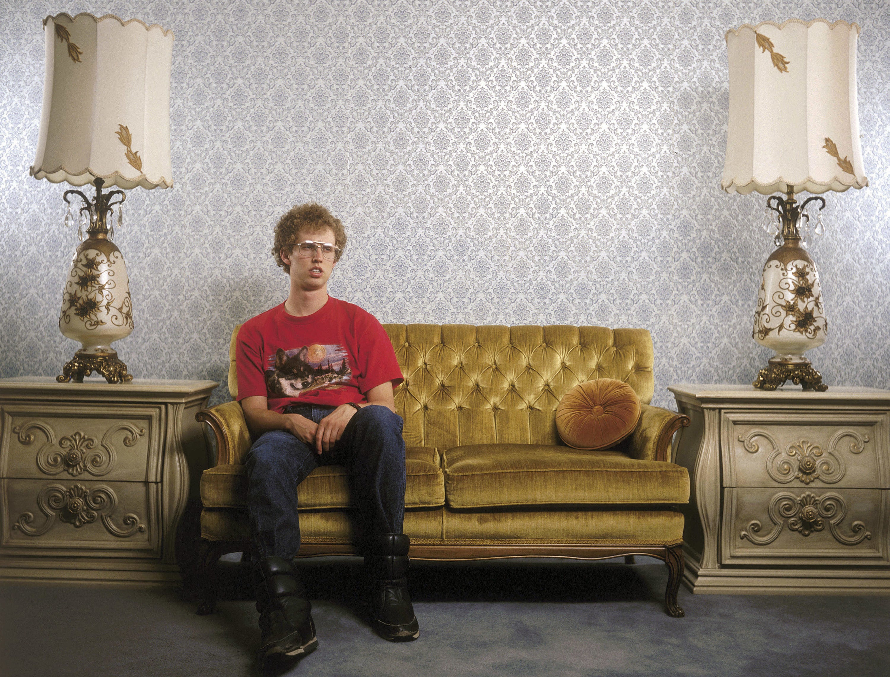 Napoleon Dynamite sitting on a couch