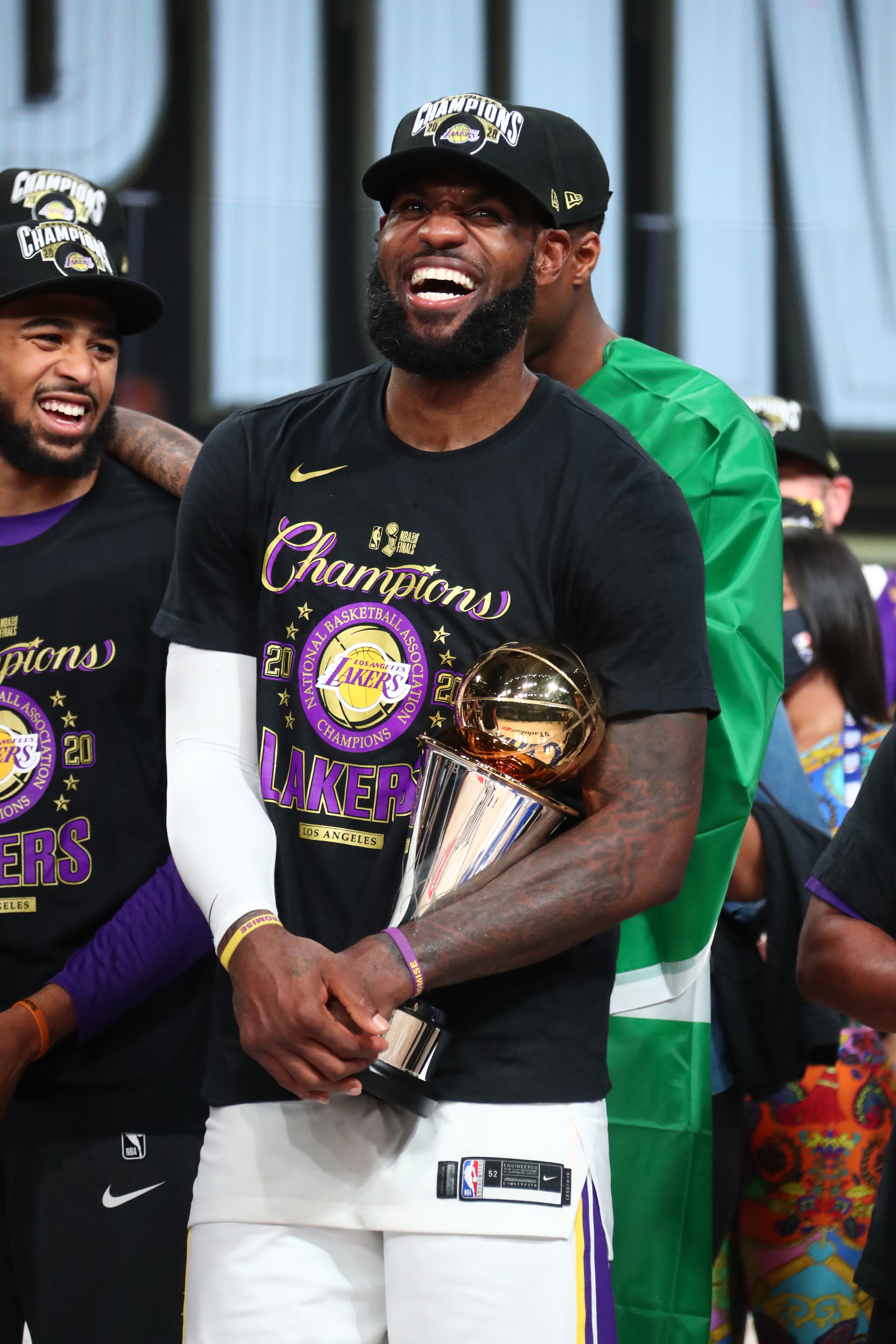 LeBron James #23 of the Los Angeles Lakers holds the Larry O&#x27;Brien Trophy and The Bill Russell NBA Finals MVP Award after winning Game Six of the NBA Finals on October 11, 2020