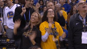 NBA fans cheering and dancing