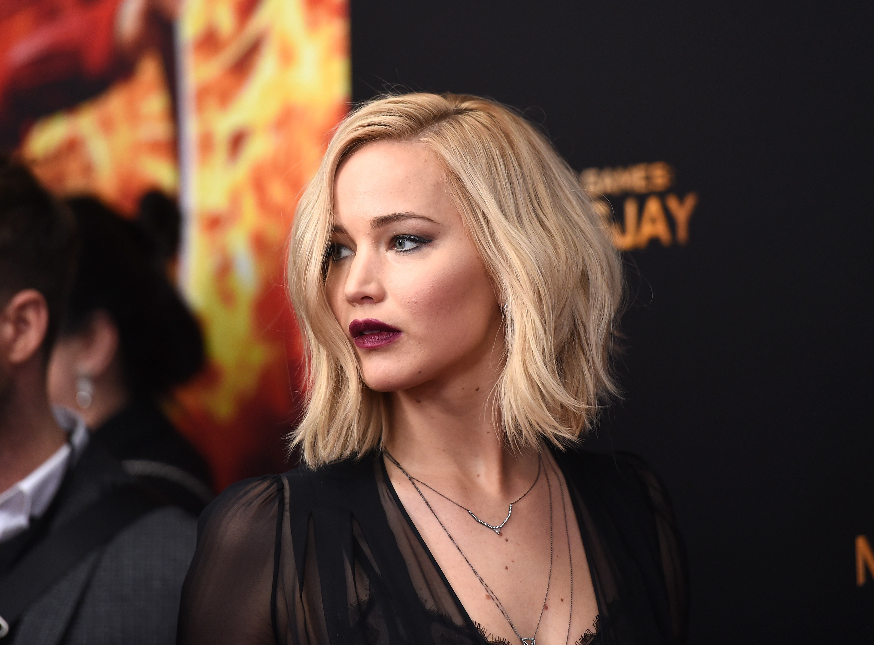 Close-up of JLaw with dramatic lip color and eye makeup