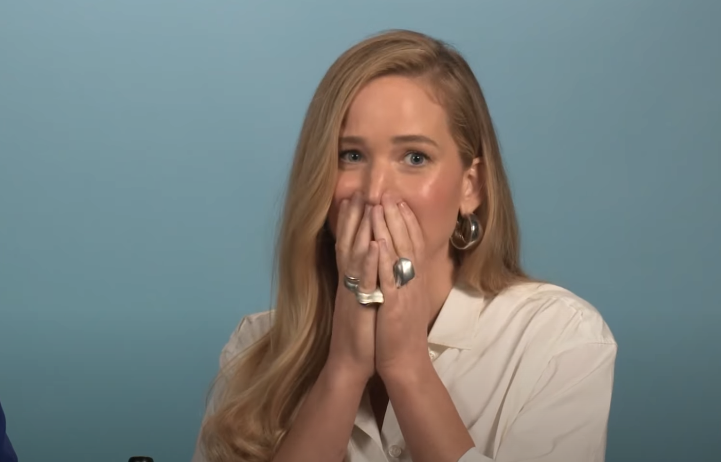 Close-up of JLaw covering her mouth