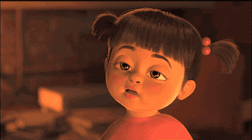 gif of Boo from Monsters Inc blinking slowly and looking almost asleep