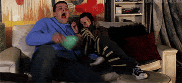 gif of Janis and Ian from mean Girls getting scared while watching a movie