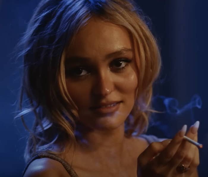 Close-up of Lily-Rose Depp as Jocelyn in The Idol holding a cigarette