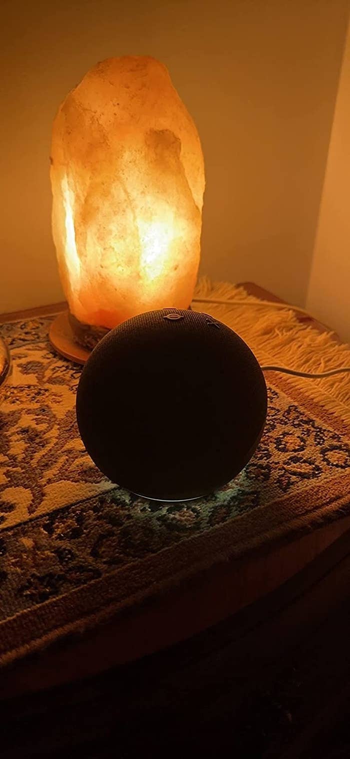 Reviewer&#x27;s dot speaker on table by crystal salt lamp