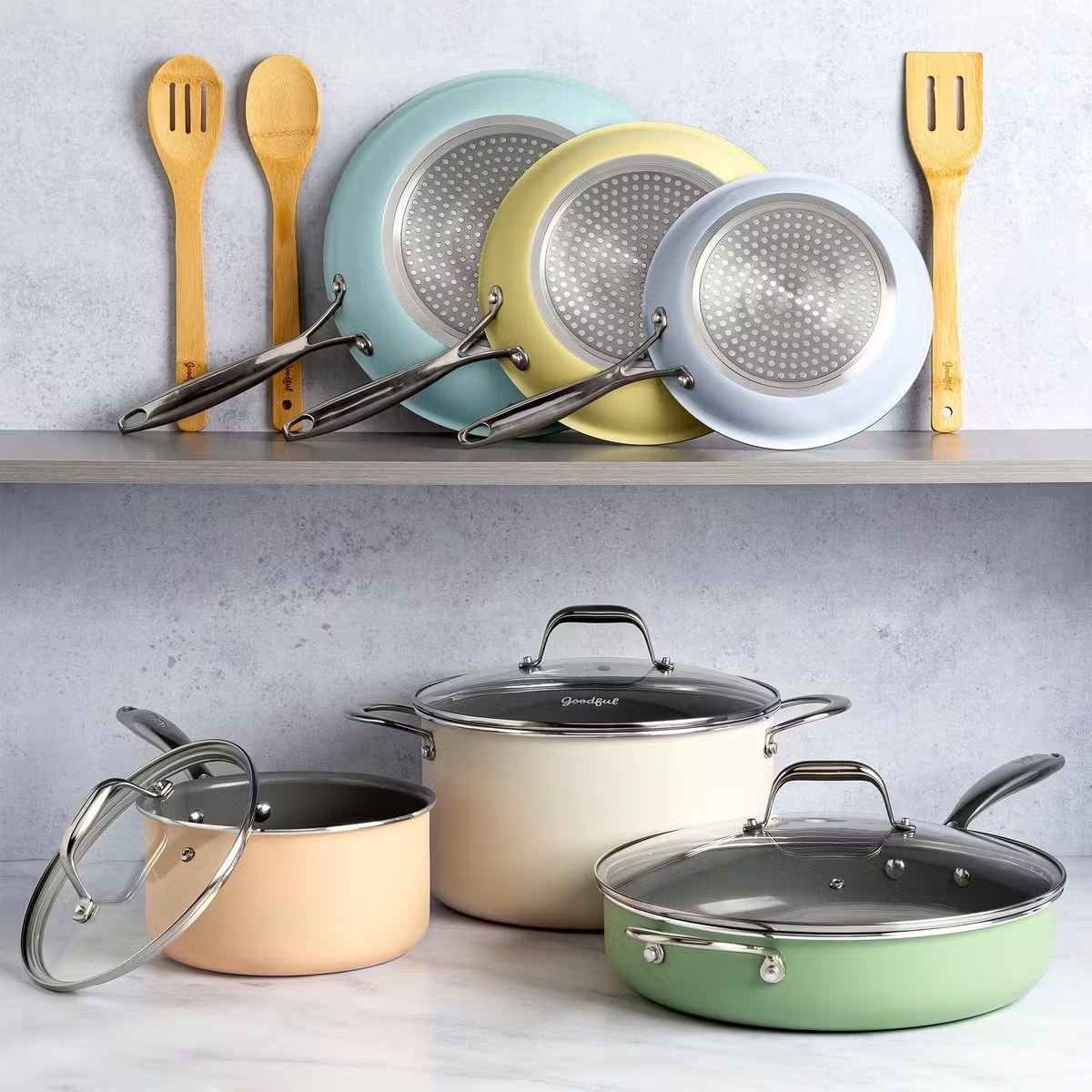 A set of pastel-colors pots and pan and utensils