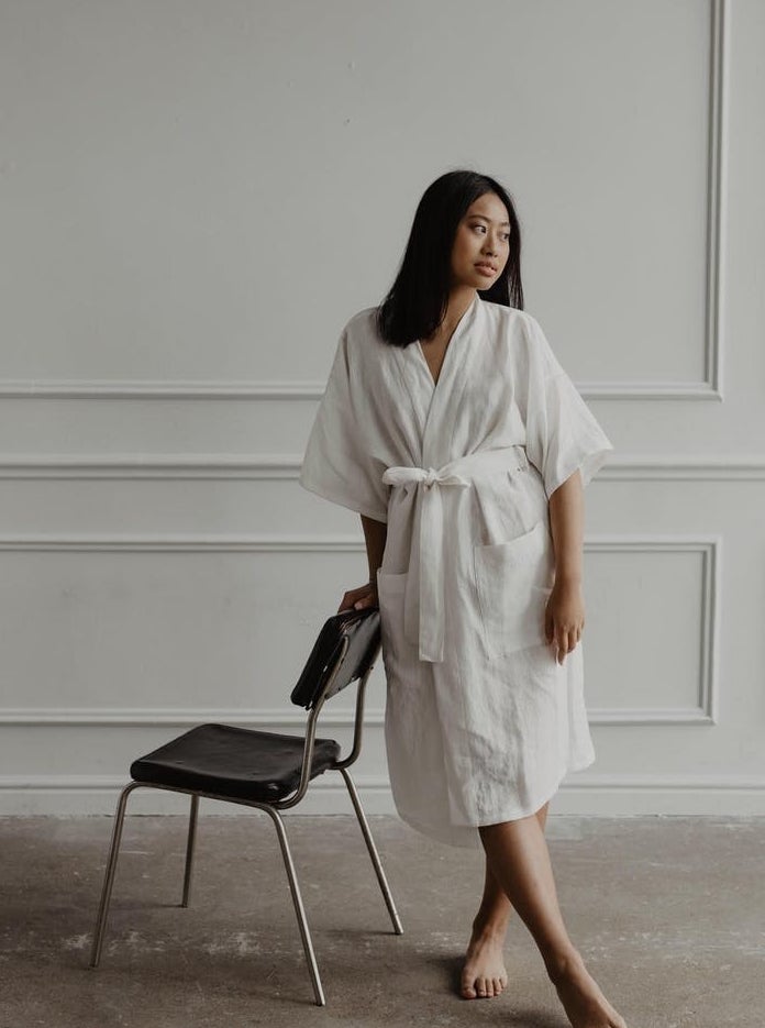 model in white linen bathrobe