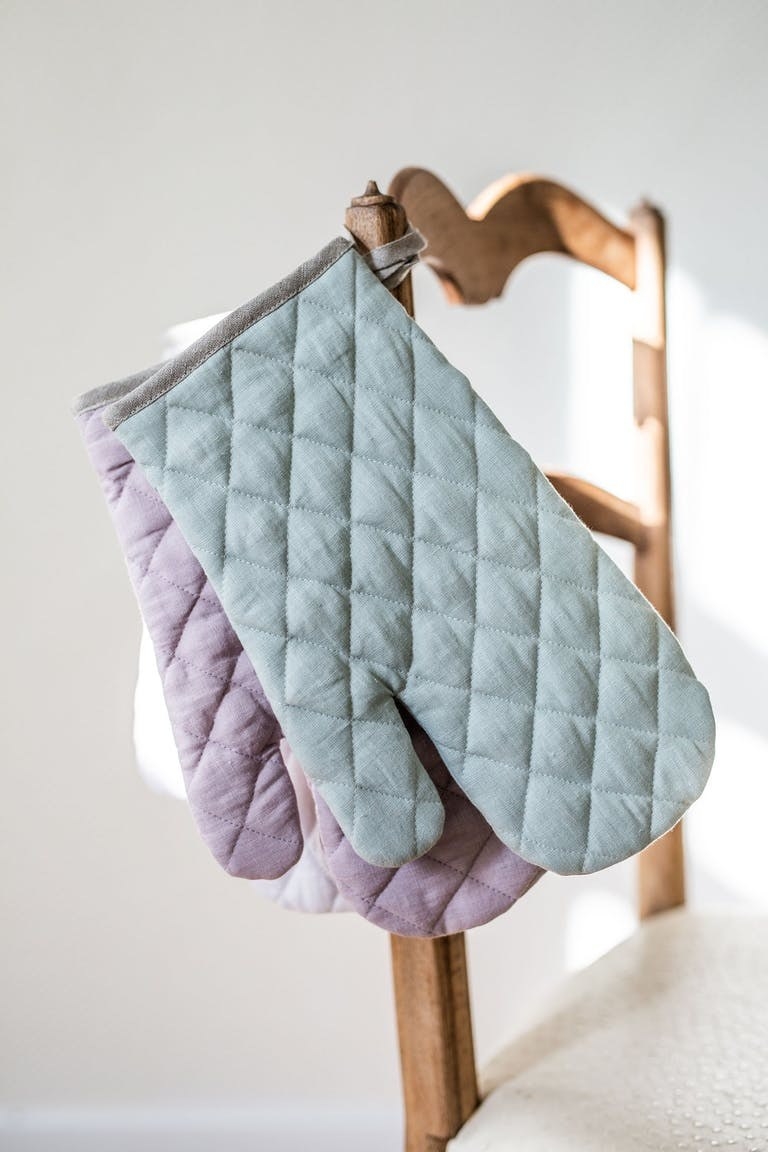 light blue and light purple quilted linen oven mitts