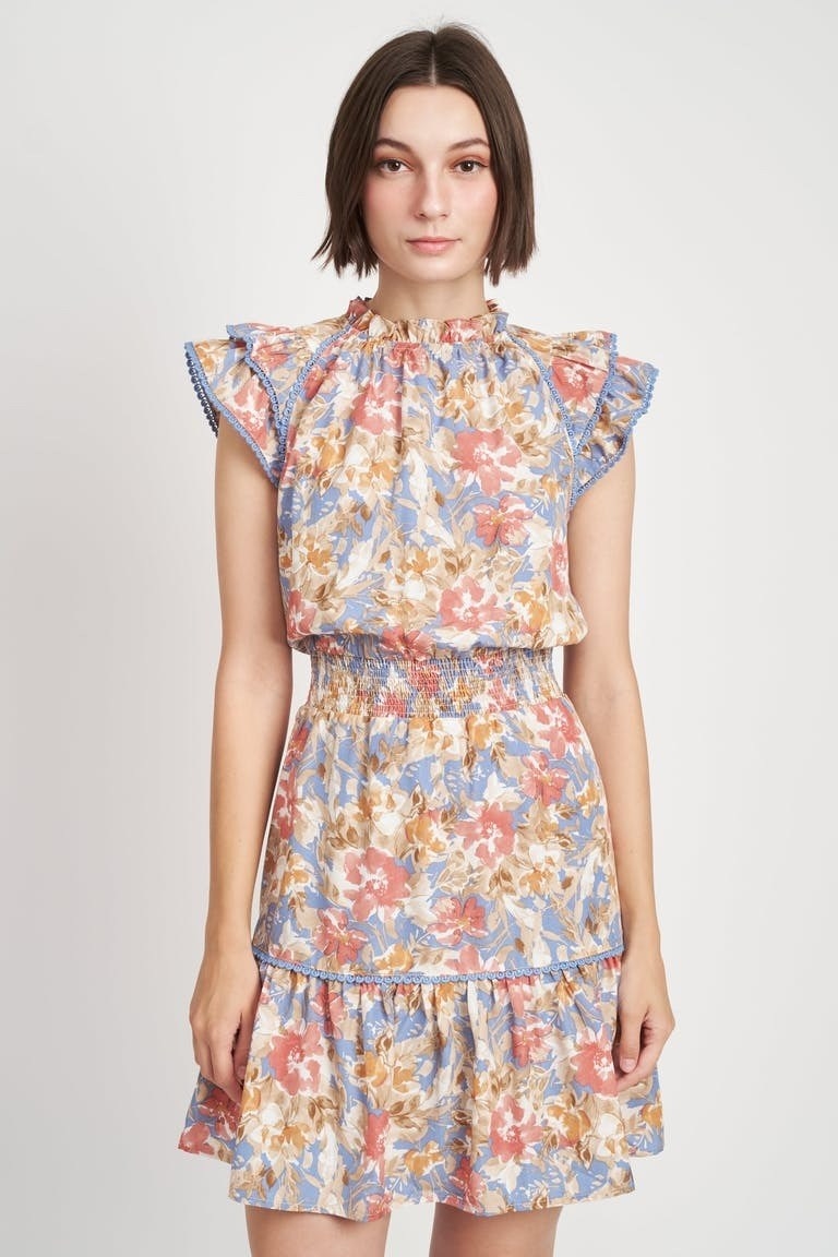 Model wearing floral ruffle mini dress