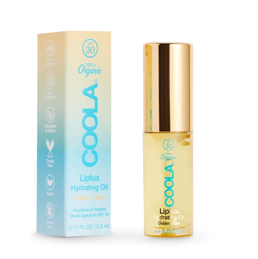 The Coola lip oil next to its box packaging