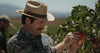 Nick Offerman eating pizza on a farm in &quot;Pizza Farm with Nick Offerman&quot;