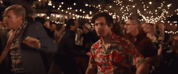 From &quot;Palm Springs&quot;: Andy Samberg&#x27;s character dances crazily in the middle of a crowd
