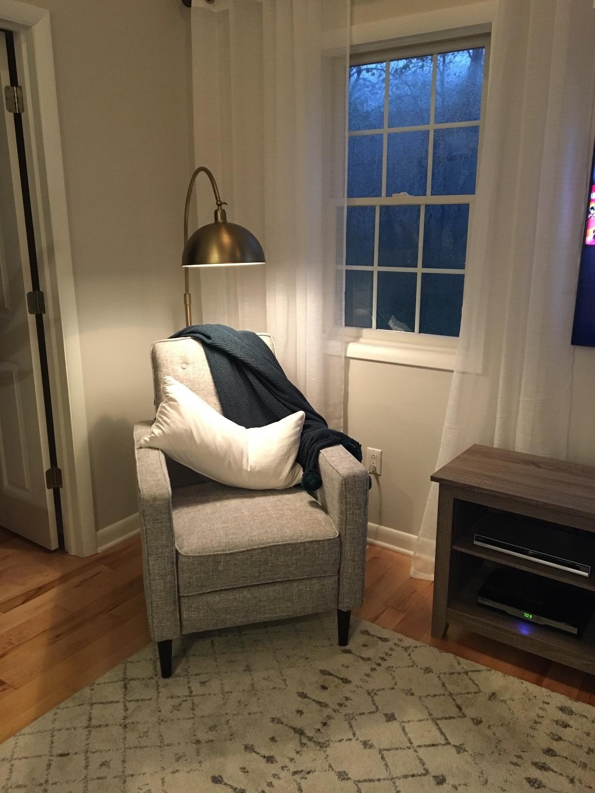 gray reclining accent chair in living room