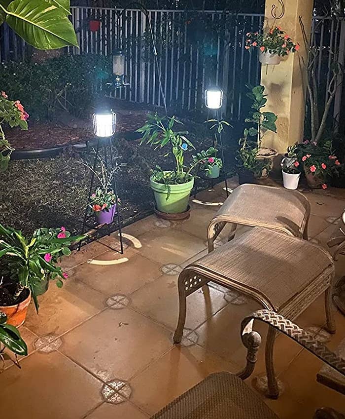 same solar lamps illuminated at night on a patio