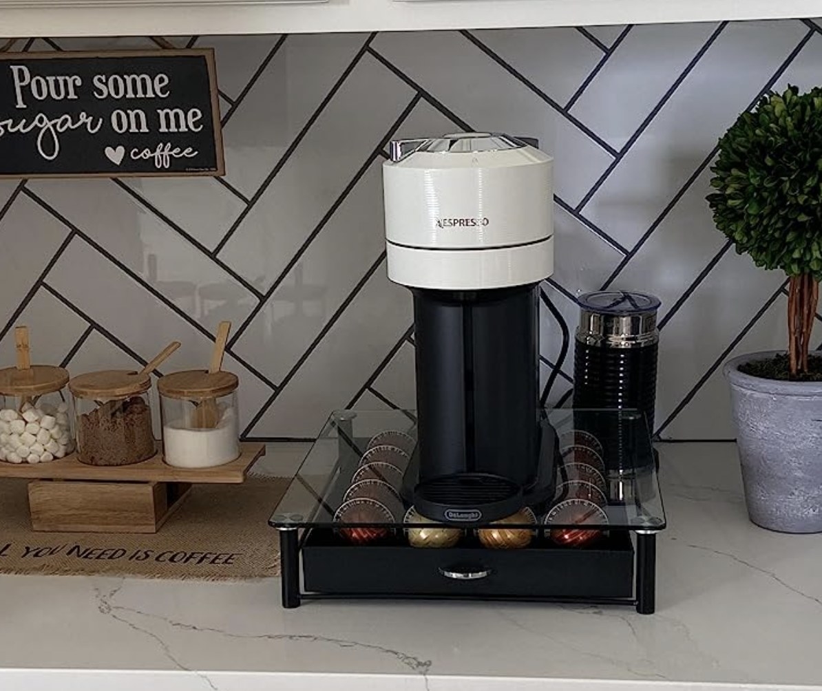 black Nespresso Vertuo Next coffee machine on kitchen counter