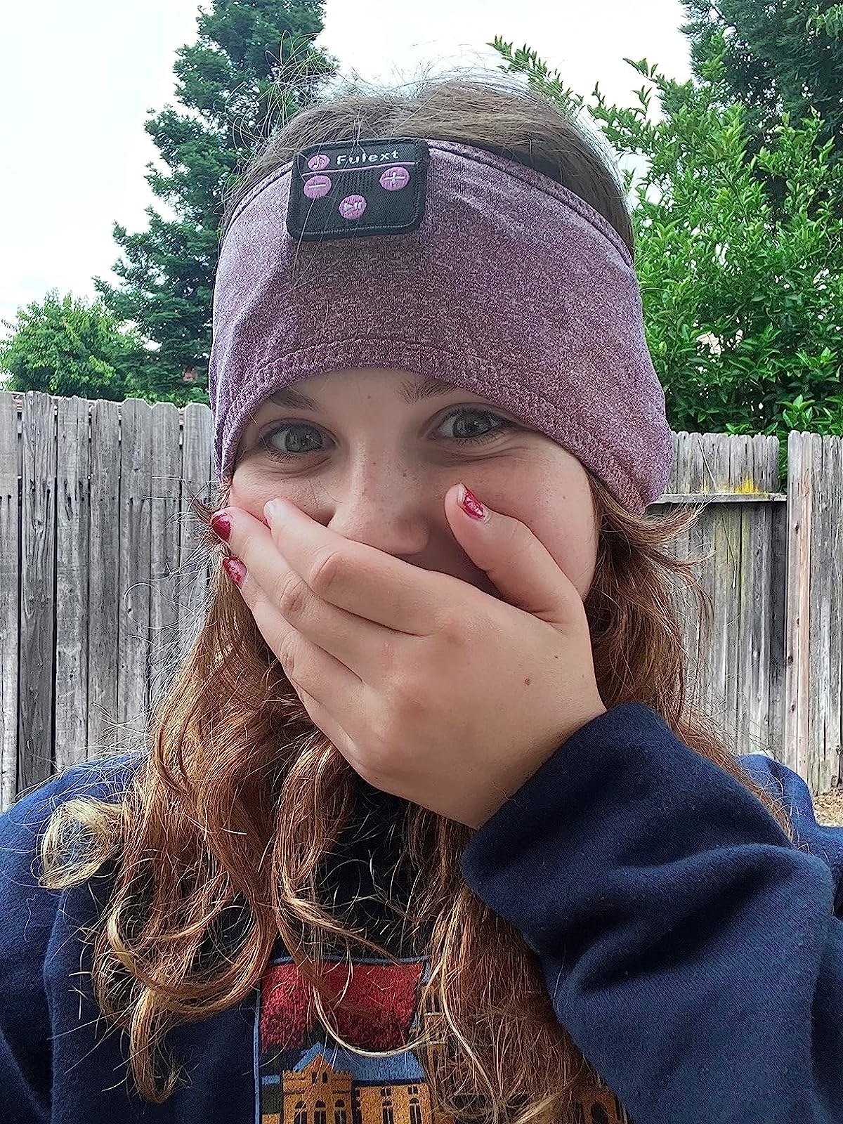 a reviewer wearing the headband in purple