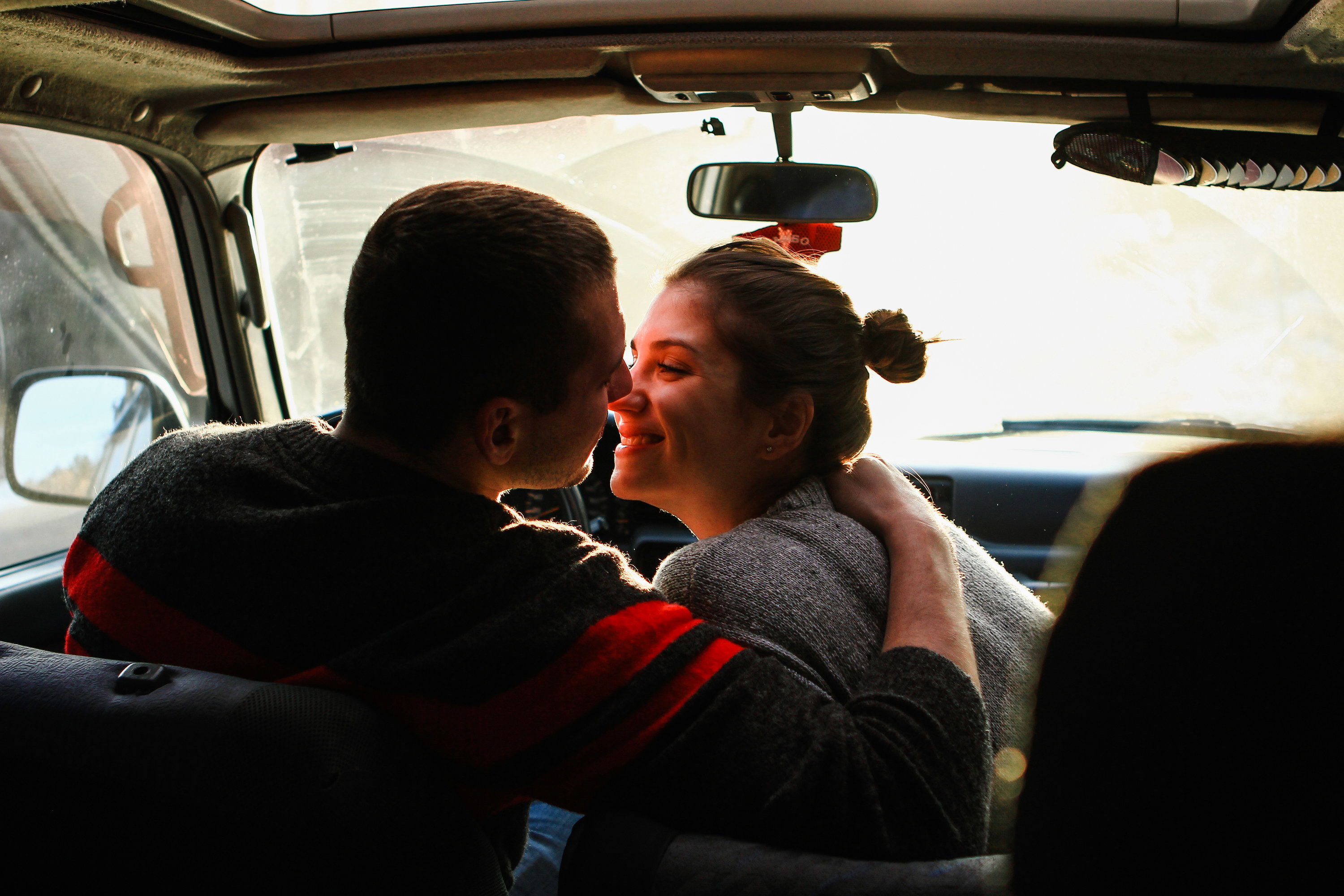 couple kissing car