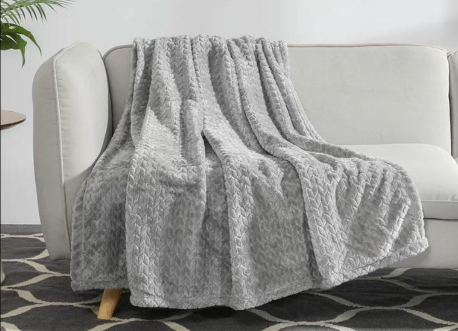 light grey plush throw blanket on couch