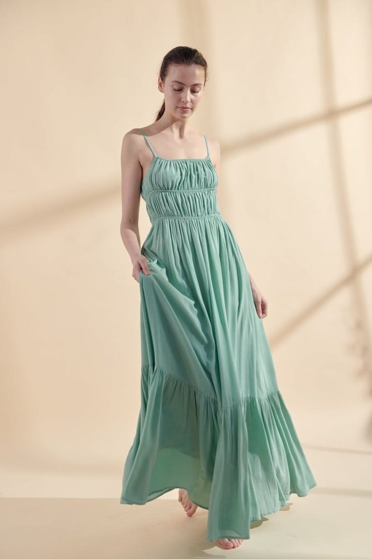 Model wearing green maxi dress