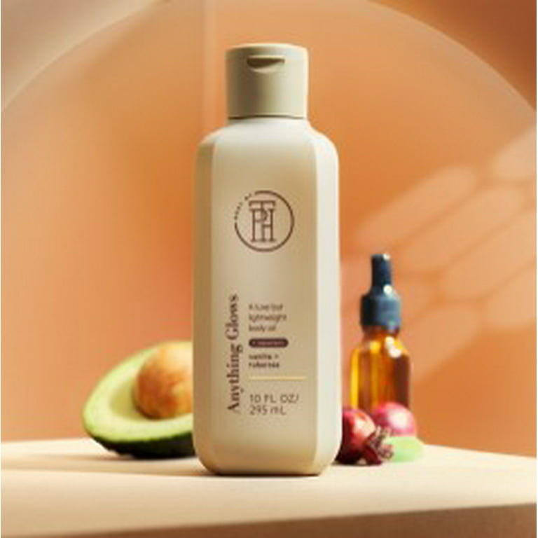 A photo of the product in a tan bottle with an avocado, oil, and rosehip behind it