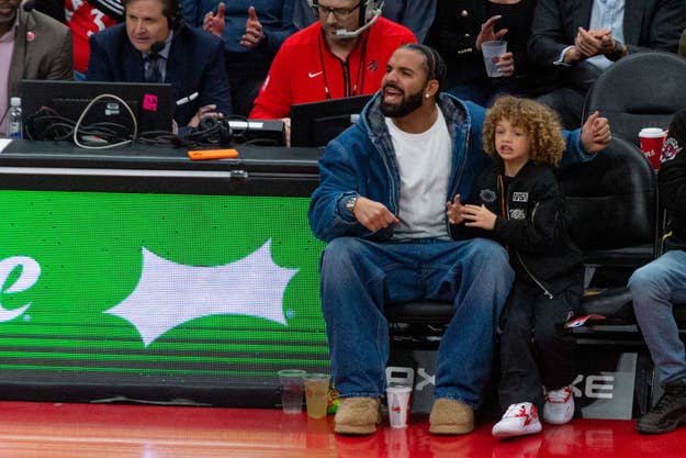 Aubrey Drake Graham a Canadian rapper and singer watches at the court during the Toronto Raptors v Charlotte Hornets NBA regular season game at Scotiabank Arena in Toronto