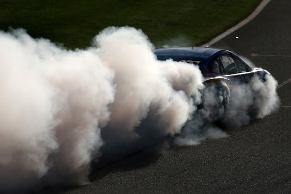 A thick cloud of smoke coming from a car