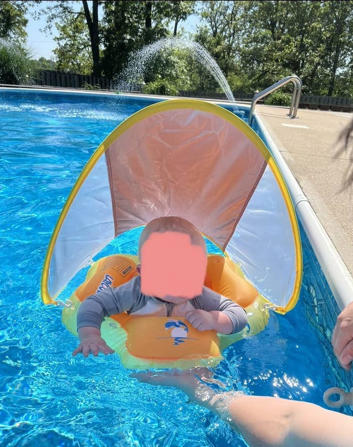 Baby in pool float