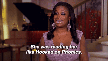 Kandi Buruss saying "She was reading her like hooked on phonics"