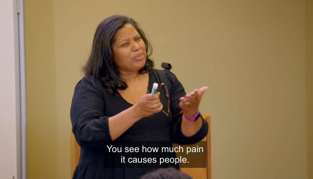 Woman saying &quot;You see how much pain it causes people.&quot;