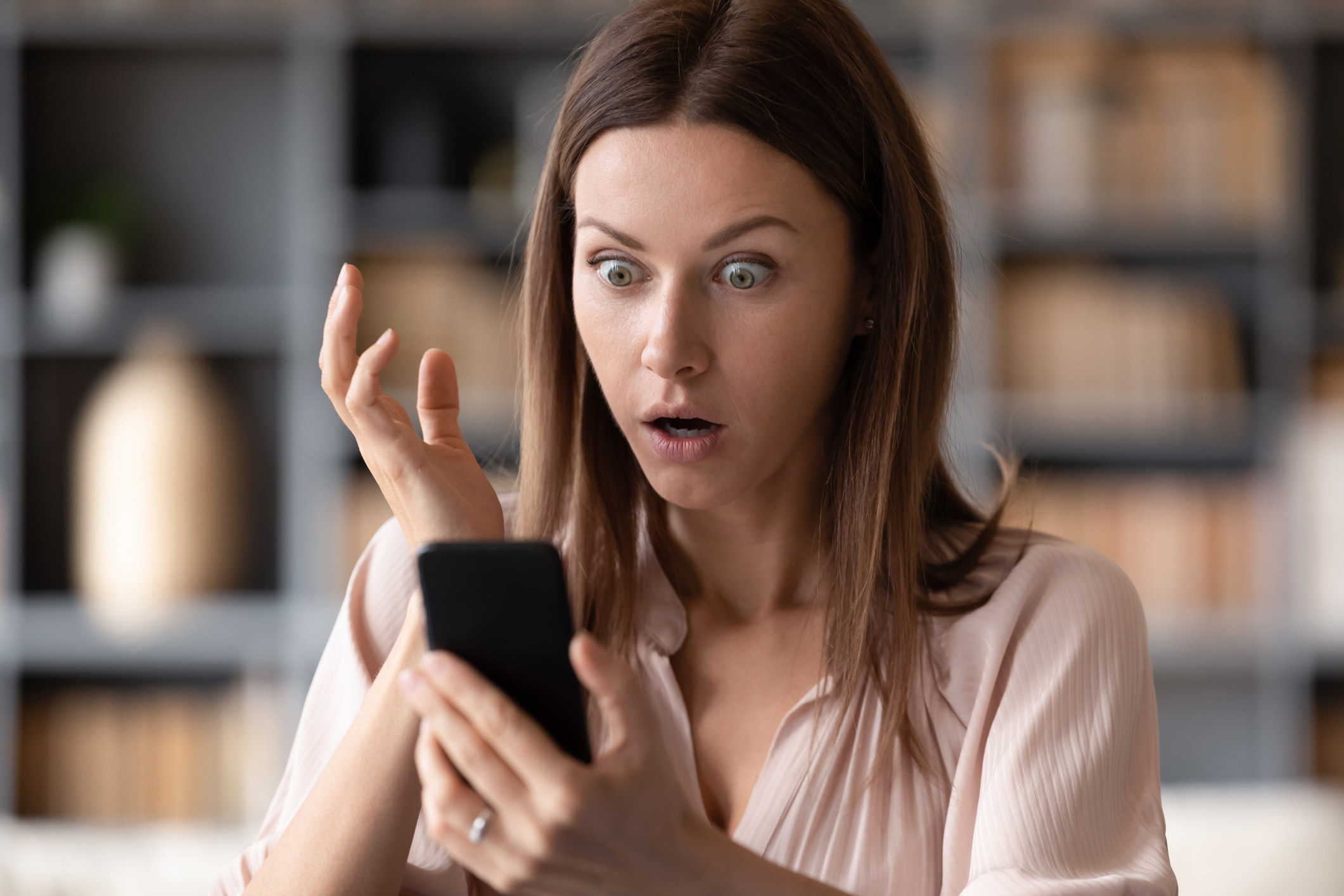 Woman shocked while looking at cellphone