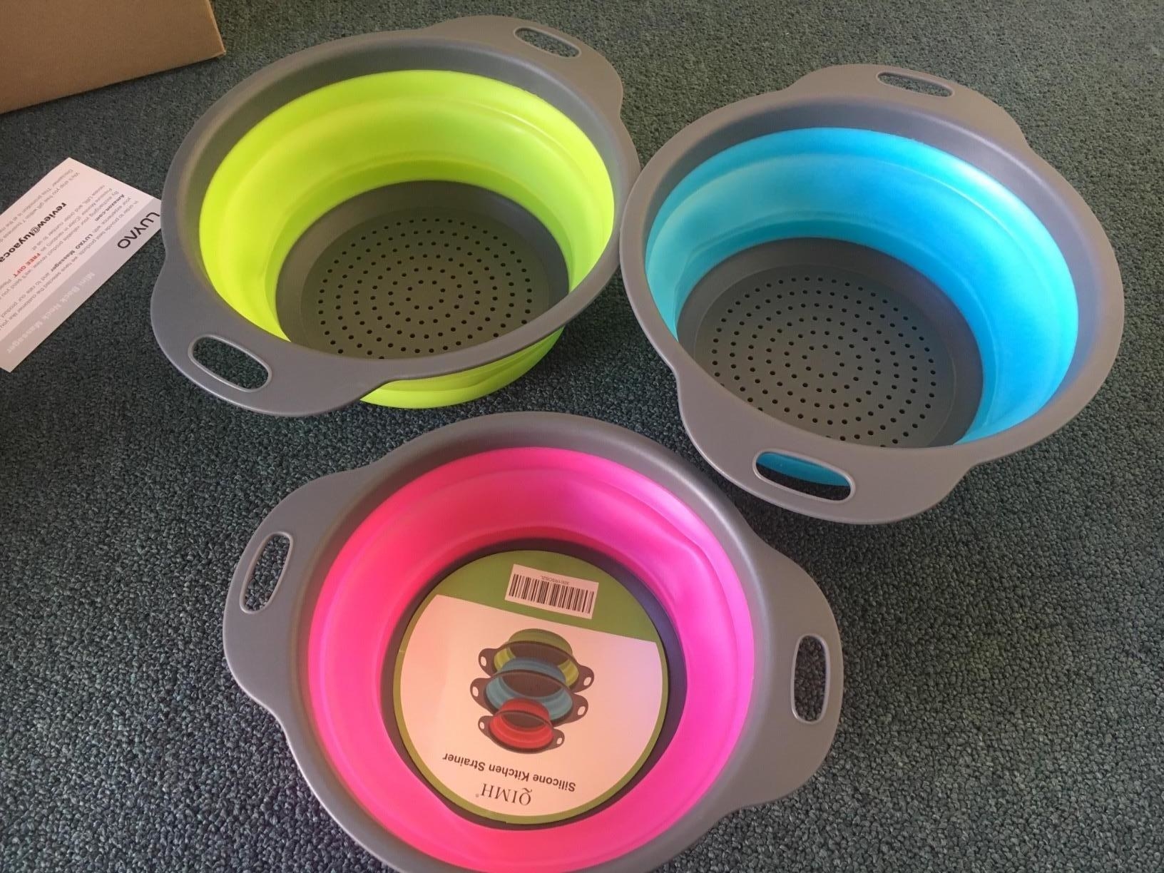 set of pink, green, and blue collapsible collanders