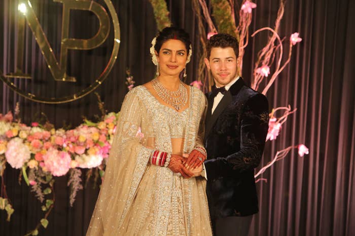 Priyanka Chopra and Nick Jonas pose for photos during their wedding reception at Taj Palace in New Delhi, India