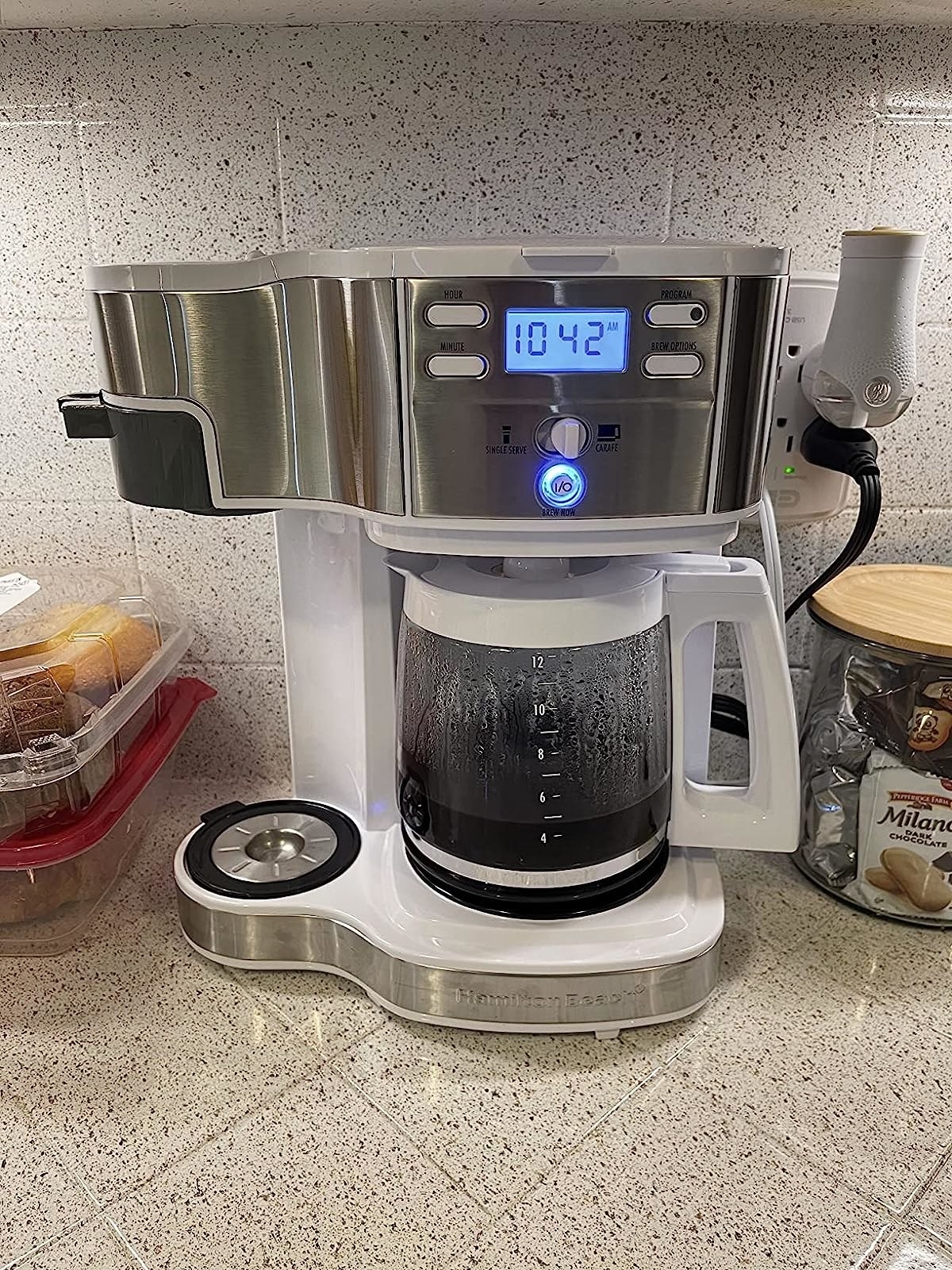 Reviewer image of the white coffee pot on their kitchen countertop