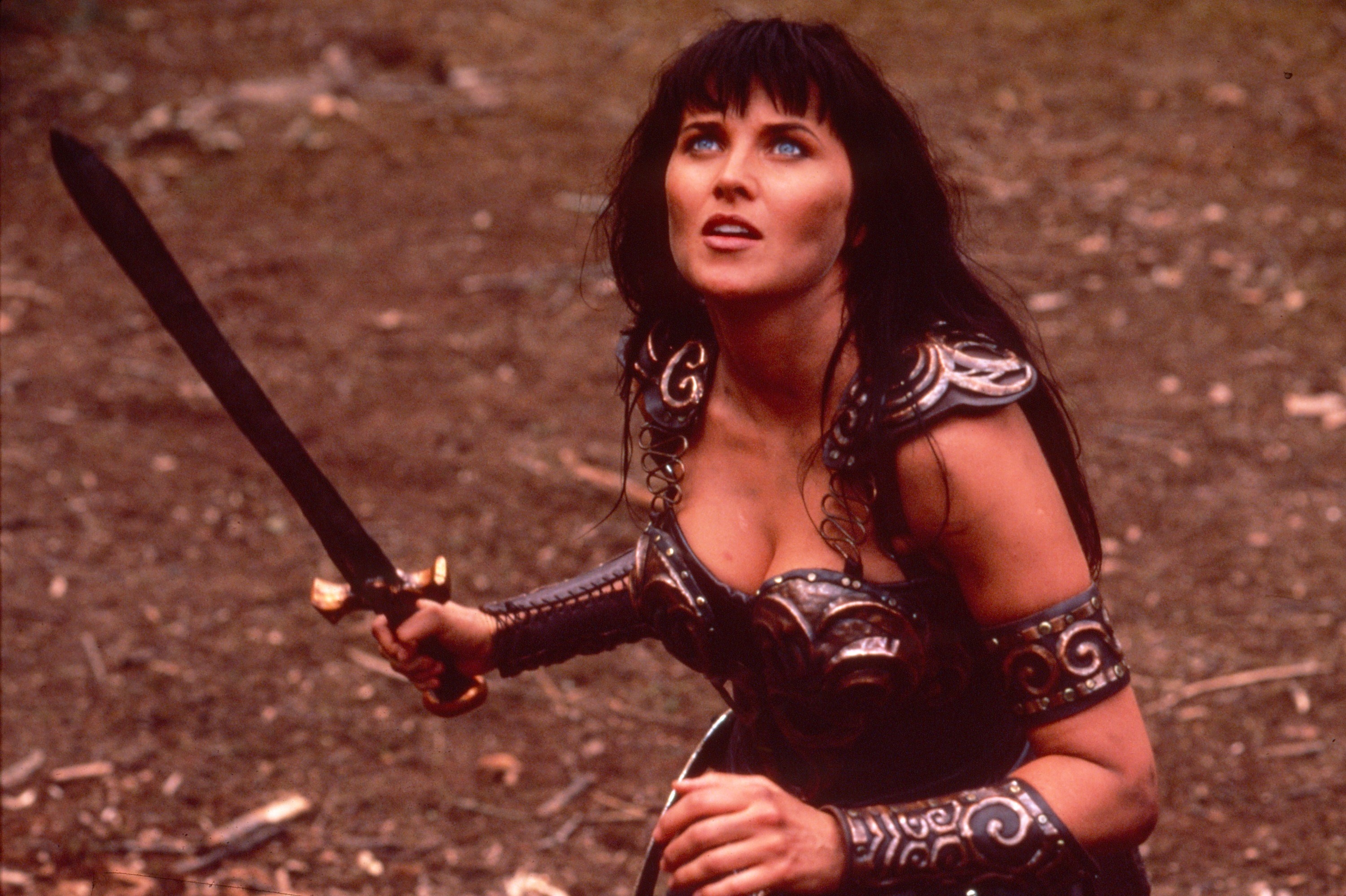 xena holding a sword and looking up
