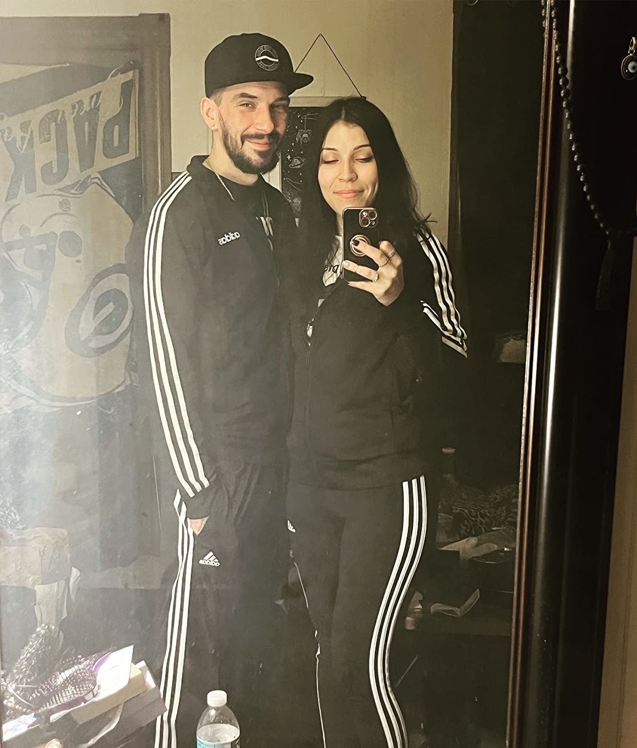 Two reviewers wearing matching track sets