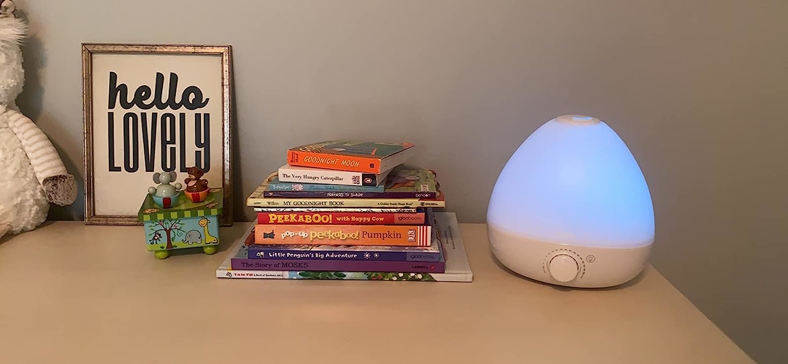 a reviewer&#x27;s photo of the humidifier with the night light switched on