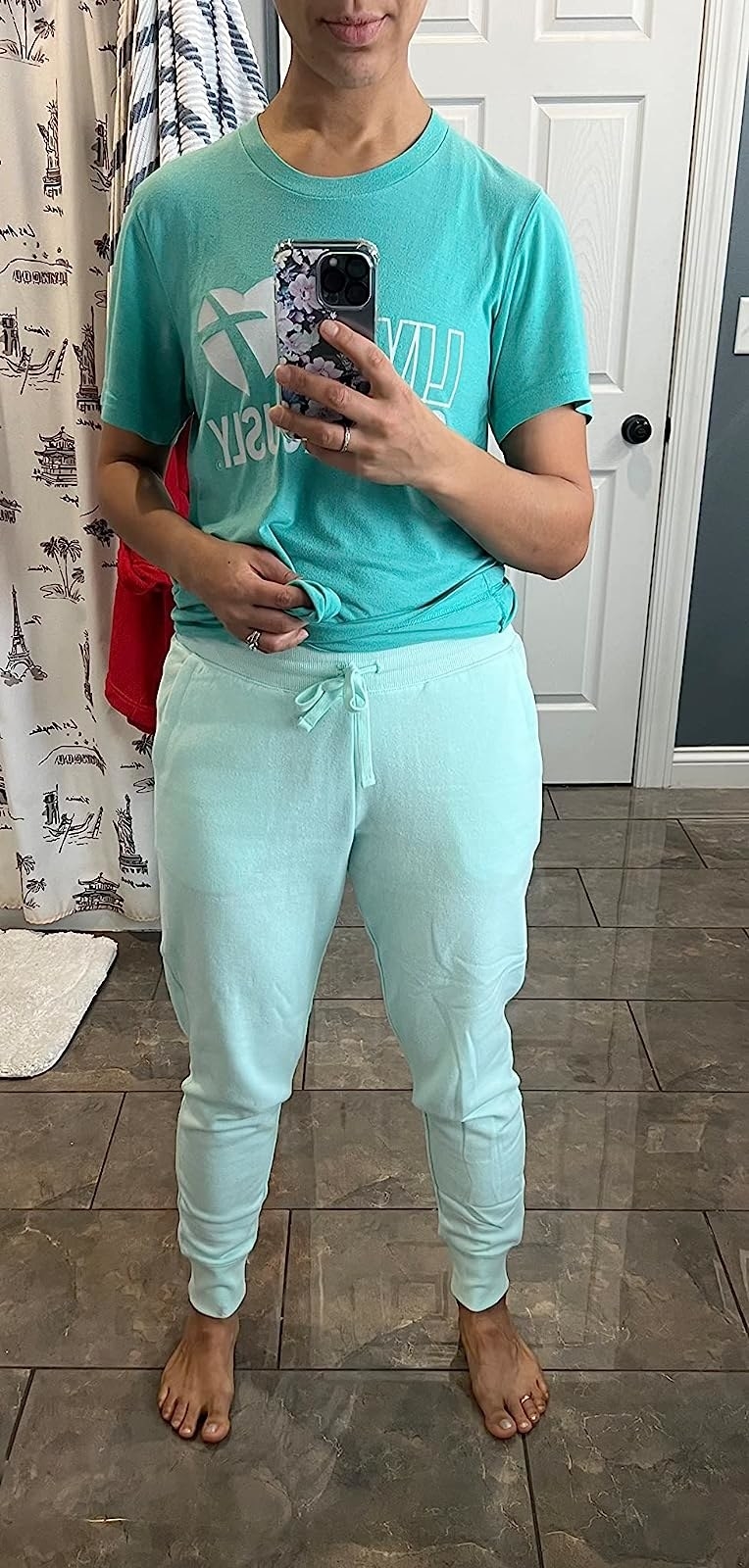 A reviewer wearing blue pants and top