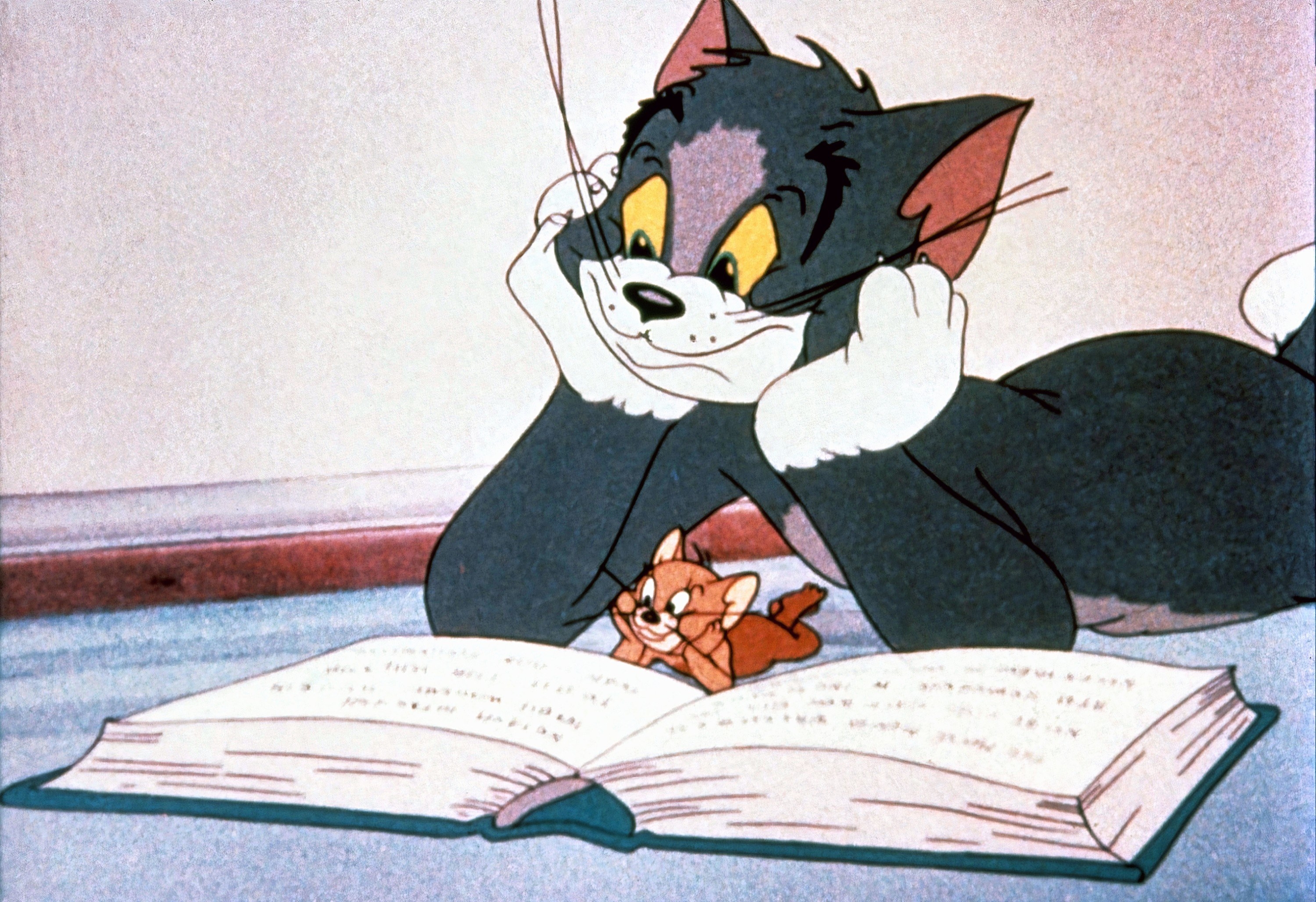 jerry and tom reading a book
