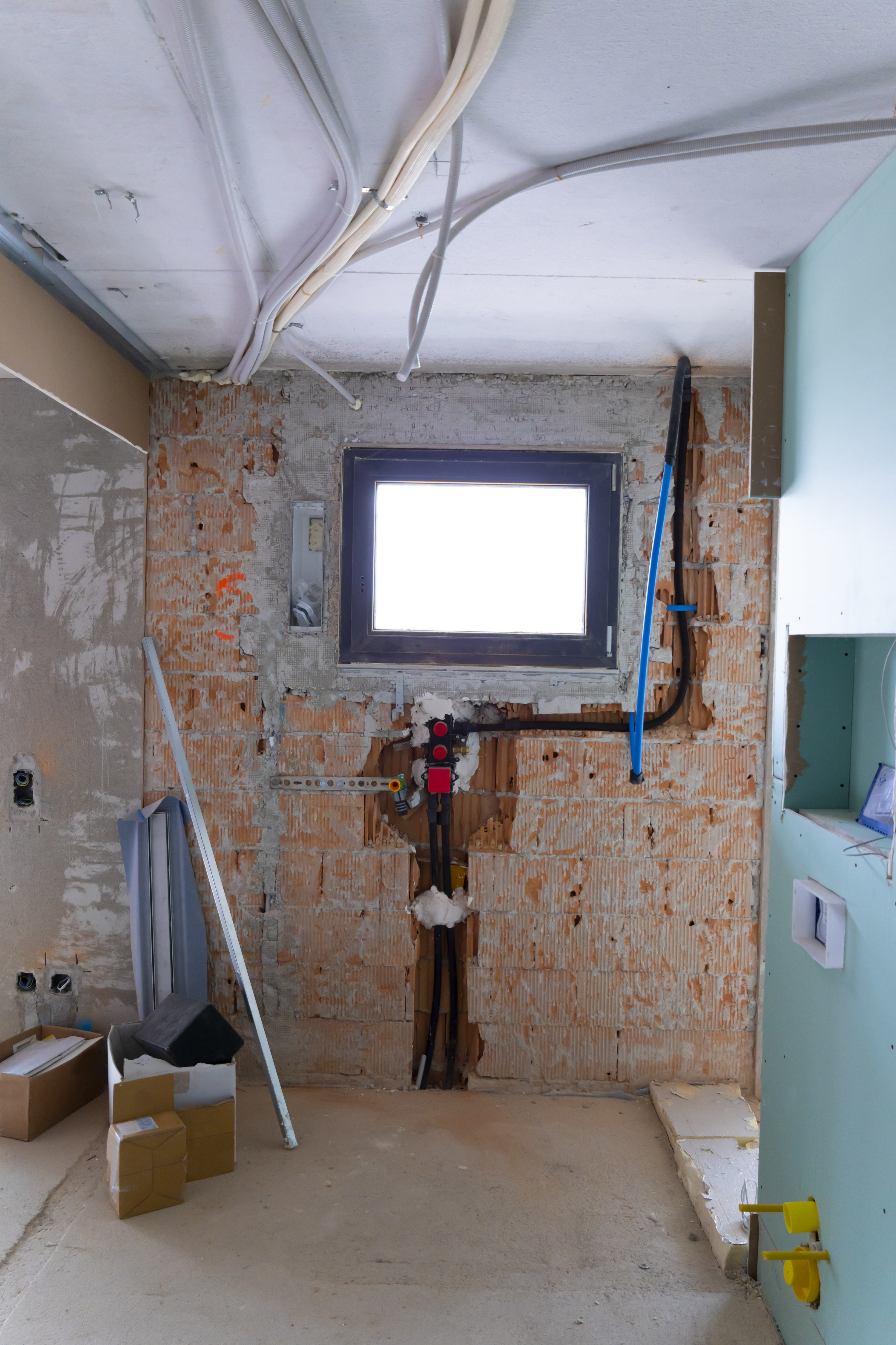 bathroom renovation with walls removed and stripped
