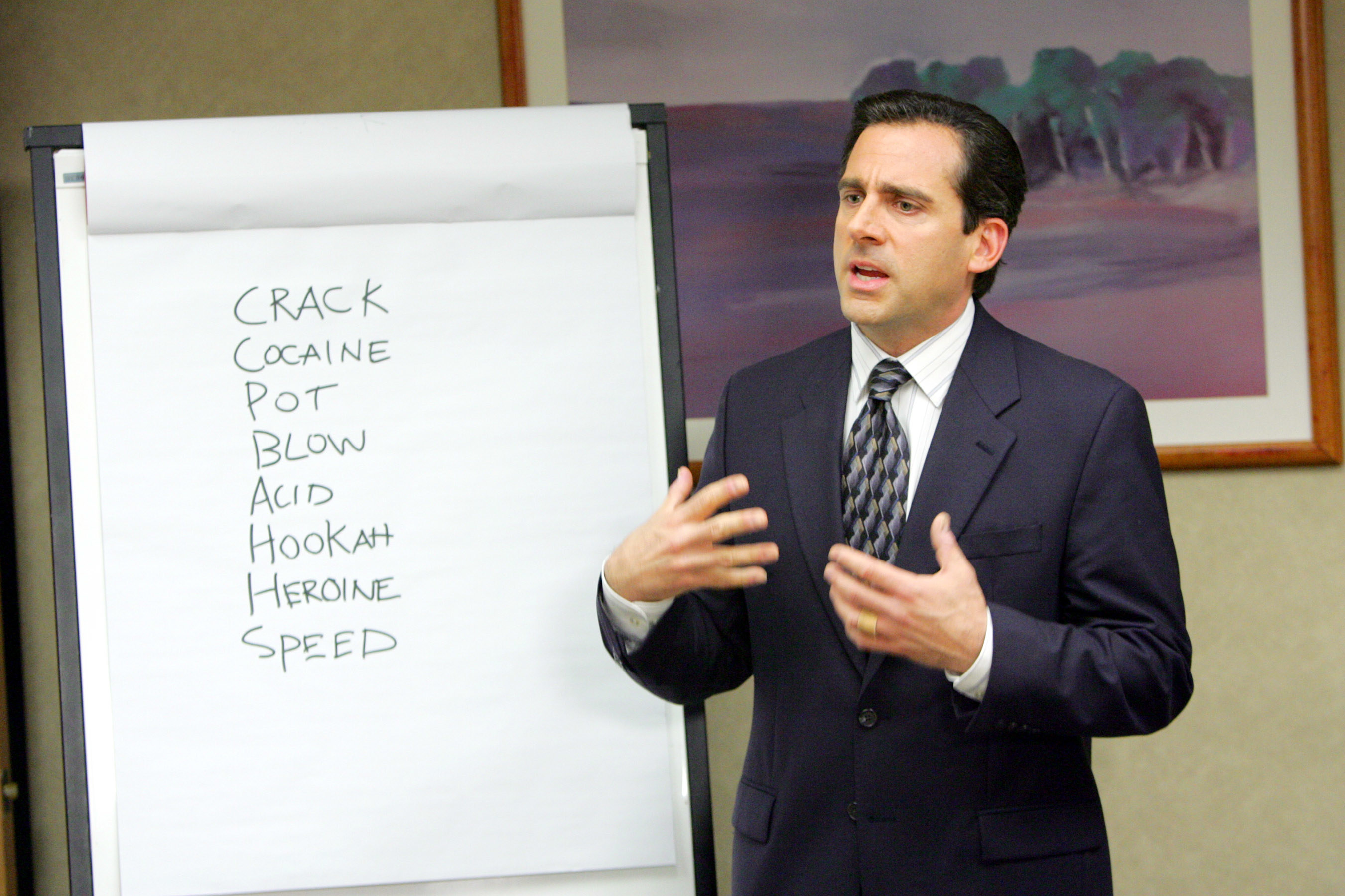 michael scott in front of a large notepad with drugs listed