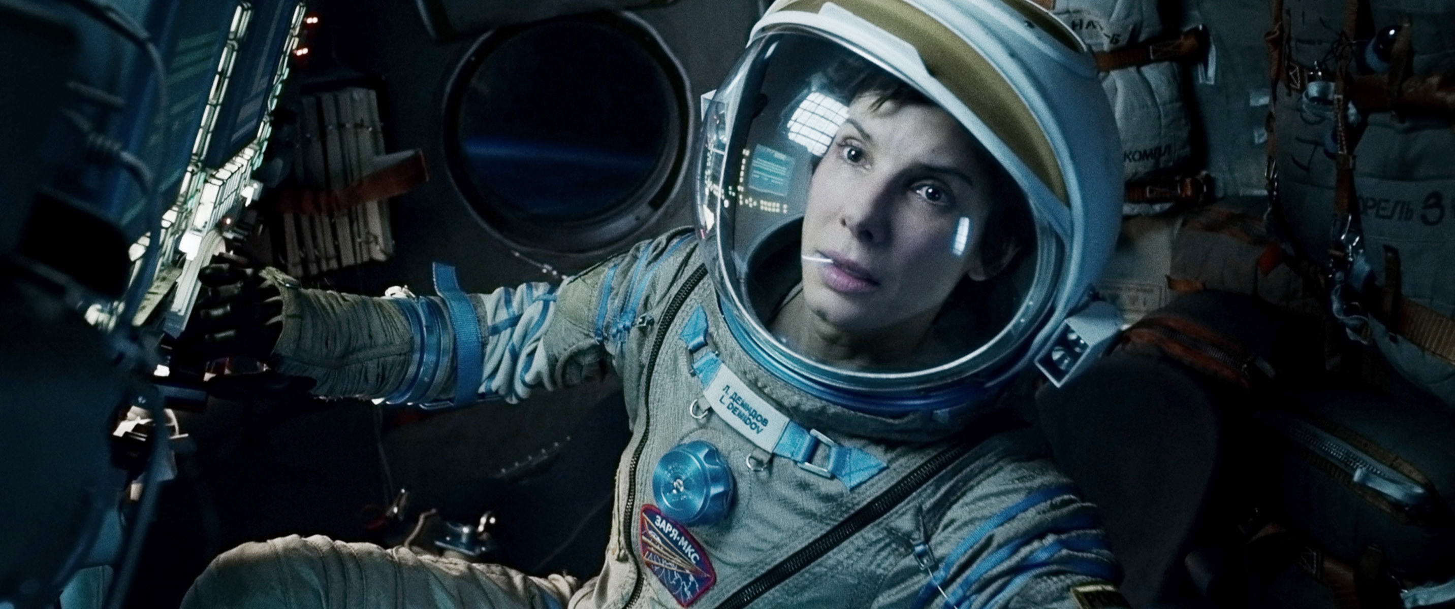 Sandra Bullock in a space suit in a scene from Gravity