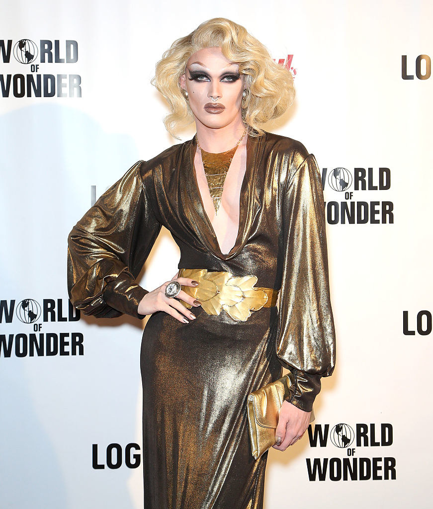 pearl at an event in a gold dress