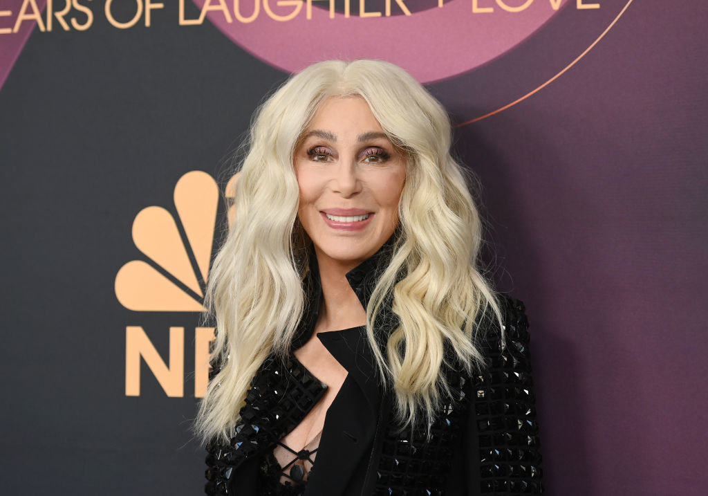 Close-up of Cher smiling at a press event